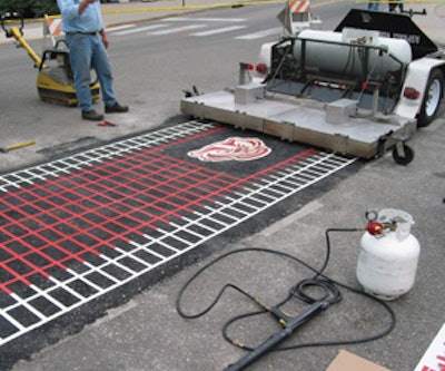 Asphalt Reheat Systems’ Manta Ray was used to install thermoplastic markings and a Badger logo at the University of Wisconsin-Madison.