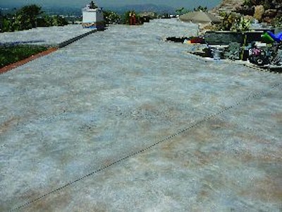 This overlay served as a cost-effective solution to an extensive cracking problem on the existing concrete.
