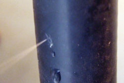 Even a small leak in a highly pressurized hydraulic hose line can pose a danger of injection risk.