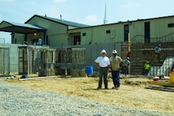 Tim Parrish, left, president of Cornerstone Foundations, and TC Curry, right, a project manager with the company, on site at a building addition project at a Virginia church.