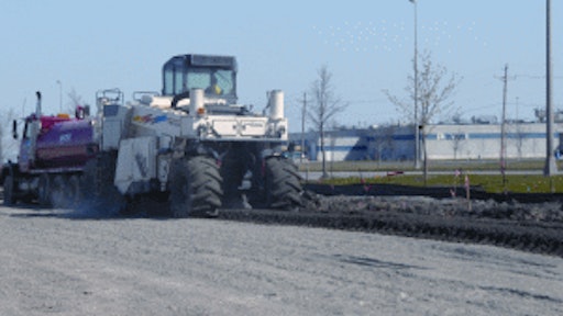 Midstate used a Wirtgen 2500 reclaimer to blend a cement additive and water with the soft soil to stabilize the parking area of the project.