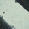 Pinholes from subsurface water.