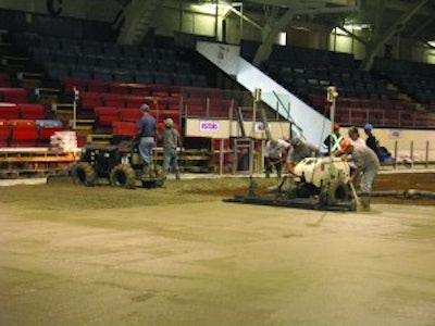 Heating and cooling lines under the concrete prevent large equipment from being on the floor, so Bravo Cement outfitted a Somero PowerRake and CopperHead screed with flotation tires to level and grade the concrete.
