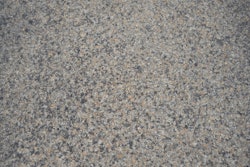 A close-up of the highway's three-course surface treatment that included the use of CRS-2P, a cationic rapid setting type of emulsified asphalt modified with the addition of polymers, and expanded clay lightweight aggregate (LWA).