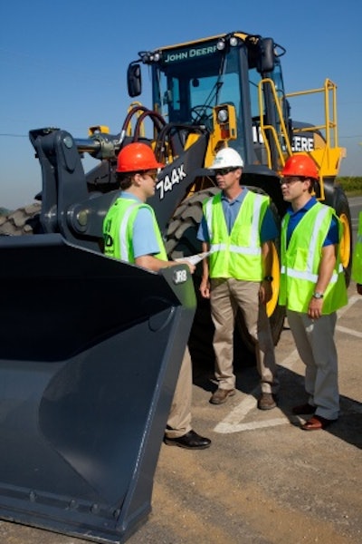 J.H. Reid, South Plainfield, NJ, takes delivery of the first John Deere 744K IT4 wheel loader. From left to right: Doug Lehmann, engineer, John Deere Dubuque Works, Eric Reid, president, J.H. Reid, and Jon Robustelli, president, JESCO, a John Deere dealership serving all of New York City, Westchester County and Long Island.