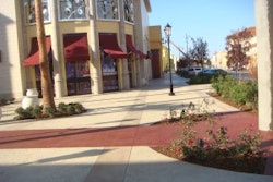 Bay Area Concretes created this sidewalk using decorative Ruby Red Glass Aggretex paving. Aggretex is a patented system for installing exotic aggregates and recycled glass aggregates into the surface of full thickness concrete slabs.