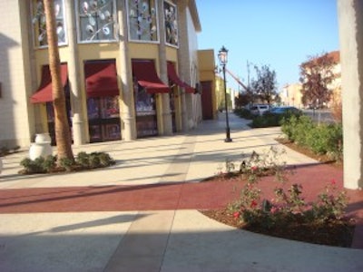 Bay Area Concretes created this sidewalk using decorative Ruby Red Glass Aggretex paving. Aggretex is a patented system for installing exotic aggregates and recycled glass aggregates into the surface of full thickness concrete slabs.