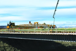 Graham Group Ltd.’s new GOMACO C-450 finisher with transitional framework was put to work right away on Highway 2 just north of Calgary. The project involved placement of 620 cu. yds. of silica-fume concrete on side-by-side bridges.