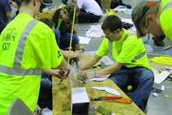 Student competitors solve a construction challenge with limited resources and time at the Seattle regional competition.