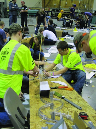 Student competitors solve a construction challenge with limited resources and time at the Seattle regional competition.