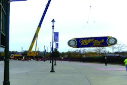 Dawes Rigging & Crane Rental lifted the 15,000-pound, 15 x 75-foot sign and its 17,000-pound steel framing from its place above the current scoreboard to make room for a new state-of-the-art scoreboard.