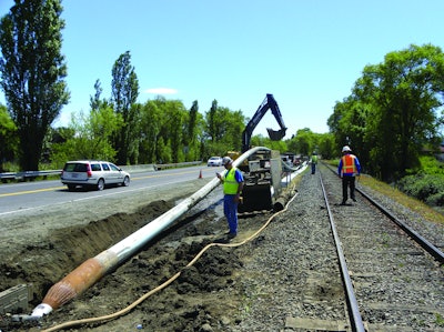 Pipe bursting allows new pipe to be installed with minimal disruption to the surrounding area. Here, Team Ghilotti uses a TT Technologies Grundoburst system to pull back new 12-in. C-900 fusible PVC pipe in St. Helena, CA.