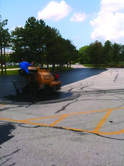 The parking lots were sealed using two SealMaster SP 300 squeegee machines which Sonnenberg outfitted with custom-made 18- to 24-in. brooms on the back of the units.