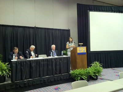Dr. Heather Brown, right, speaks about the new concrete-focused MBA through CIM. Seated, from left to right: Mike Schneider, Senior VP at Baker Concrete and National Steering Committee member for CIM; Dean Jim Burton of the Jones College of Business at MTSU; and David Vickers, National Steering Committee member for CIM.