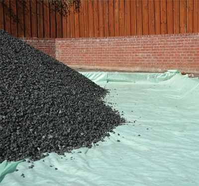 The PERC pervious concrete infiltration fabric is placed as a separation layer between the softer, less compacted soil base and the stone filter layer.