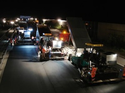 On the A 99 near Munich, Germany, four Vogele Supere 1800-2 pavers with SprayJet Module worked in echelon 'hot to hot' to produce a noise-reducing thin asphalt overlay.