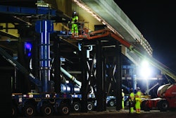 The self-propelled modular transporters - hydraulic jacks on wheels, controlled by a single joystick - were used to lift the 354-foot, 3.8 million-pound structure 21 feet in the air.