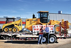 Arin Laugtug, Towmaster regional sales manager, gives Brook Hinman of A-1 Tractor, Kingman, Ariz., a Model TE-12D 12,000-lb. drop-deck trailer at The Rental Show.