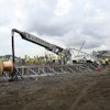 Six Putzmeister Telebelt TB 130 telescopic belt conveyors place concrete and gravel for the Panama Third Set of Locks' batching and crushing plant's foundation.