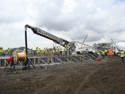 Six Putzmeister Telebelt TB 130 telescopic belt conveyors place concrete and gravel for the Panama Third Set of Locks' batching and crushing plant's foundation.