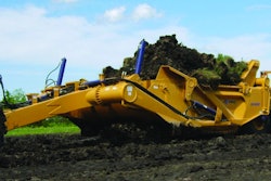 K-Tec's 1453 scraper hauls up to 53 cu. yds. Four 29-in. tires provide flotation.