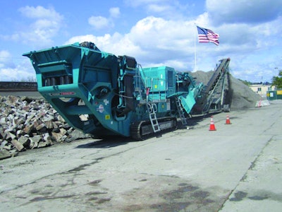 The Pegson XH320SR is shown at work crushing concrete rubble at one of Ghilotti Brothers' four recycling yards.