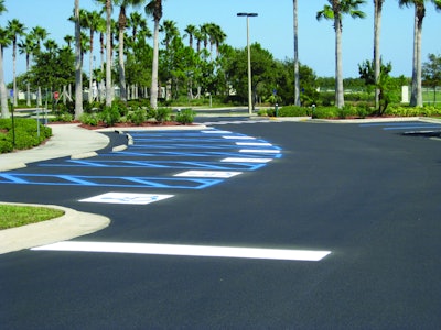 Because it was a government job, Robert had to restripe the handicap stalls exactly as they were with several different designs on each parking lot. Photo documentation was used to ensure proper painting.