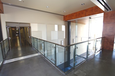 At Miramar College, Surfacing Solutions polished 9,000 square feet of floors, including this second floor area. Crews had to use a lift to get grinders through a framed window because elevators were not working.