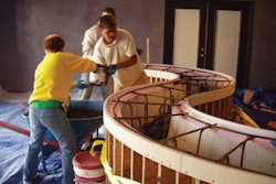 The crew at the Decorative Concrete Institute had to manually place concrete into a countertop form after a pump mishap.