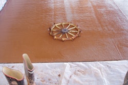 Recycling artists utilize materials that might otherwise end up in the landfill. We did some recycling art of our own by embedding a sprocket we found on our property in fresh concrete prior to polishing.