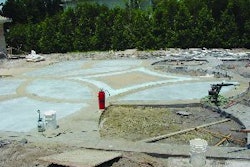 The 2,500-sq.-ft. courtyard was worked in sections outward from a central design. The separate pours are held together with steel dowels.
