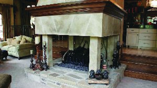 Michael Pizzolongo Sr. uses stucco and concrete to create decorative pieces, like this fireplace, at a fraction of the weight when using brick and mortar.