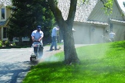 'As far as the maintenance, it all goes hand in hand,' says Jeff Schmitt, owner of Kettle Moraine Asphalt Maintenance. Before sealing the driveway, the crew edges, fills cracks, and blows away debris.