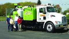 Dave Fisher, Hannah Smith, Tom Kuhns, and Lesa Kuhns (from left) with Capitol Sweeping Services' new infrared repair machine, the contractor's next step in bringing services in-house to help stabilize cash flow, keep employees busy, and become even more essential to its customers.