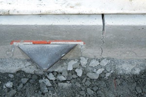 Using plate dowels that allow horizontal slab movements both perpendicular and parallel to joints lowers the risk of random cracking.