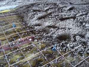 Plastic rebar chairs can help prevent punctures in a vapor retarder that can happen with metal chairs.
