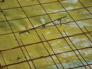 Plastic rebar chairs can help prevent punctures in a vapor retarder that can happen with metal chairs.