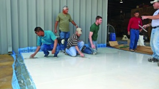 Mike Emma and Kurt Ziegler, kneeling on right, attended a skim coating class at the Decorative Concrete Institute four days after returning home from a tour of duty in Iraq.
