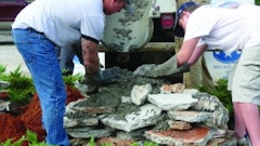 Bob Harris and son Robby Harris reuse concrete test slabs to create a foundation for a one-of-a-kind boulder.