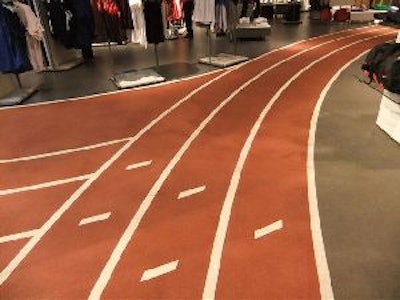 A custom made, 7,000-lineal-foot-long adhesive running track stencil was used on the surface. Once the stencil was down and the surrounding areas masked off, the track was splattered down the SYPP Red colorant in THIN-FINISH in two coats.