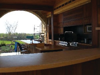 Concrete Jungle created multiple concrete countertops for an outdoor kitchen, including an island and multi-level counters.