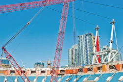 The primary crawler crane, which can lift 1,100 tons, took Triton Transport 75 trailer loads to move into the stadium and was used for the first three months of construction to assemble the 36 steel masts that support the new retractable roof.
