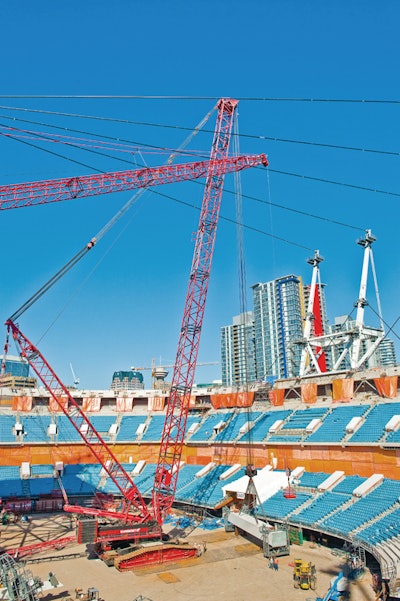 The primary crawler crane, which can lift 1,100 tons, took Triton Transport 75 trailer loads to move into the stadium and was used for the first three months of construction to assemble the 36 steel masts that support the new retractable roof.