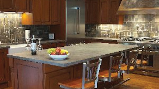 M.A. Del Col Color Impressions created this 9-ft. countertop with a bar sink and 4-ft. by 8 1/2-ft. center island countertop.