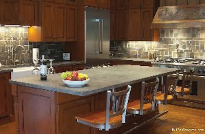 M.A. Del Col Color Impressions created this 9-ft. countertop with a bar sink and 4-ft. by 8 1/2-ft. center island countertop.