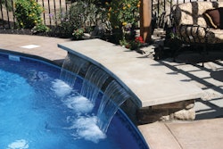 This concrete bench was precast and then placed over the waterfall to create this water feature.