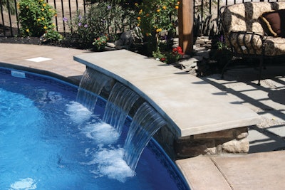 This concrete bench was precast and then placed over the waterfall to create this water feature.