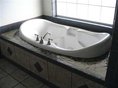 The shower and tub surround, which was somewhere between 400 and 700 square feet of work, took Hugh Miller about three days to complete.
