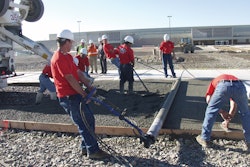 A pervious concrete pavement placement works like an assembly line, says Dale Fisher, with crew members working the ready-mixed truck's chute, members working the screed, and others following with finishing tools.