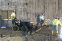 A Lindsay Lampasona crew uses a Somero Power Rake to verify subgrade tolerance before striking off a 20,000-square-foot floor at a Walmart in North Smithfield, R.I.